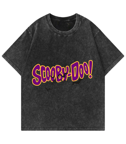 Black t-shirt with 'Scooby-Doo!' text in purple and yellow on a white background